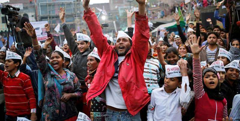 AAP supporters shout slogans during a campaign meeting in Delhi